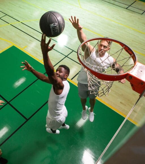 a gym member scores during a pickup basketball game at emerald city athletics gym in everett