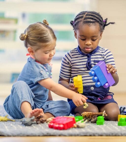 children play with toys in the onsite childcare area at emerald city athletics gym near me
